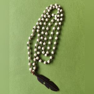 Elegant White Beaded Necklace with Feather Pendant